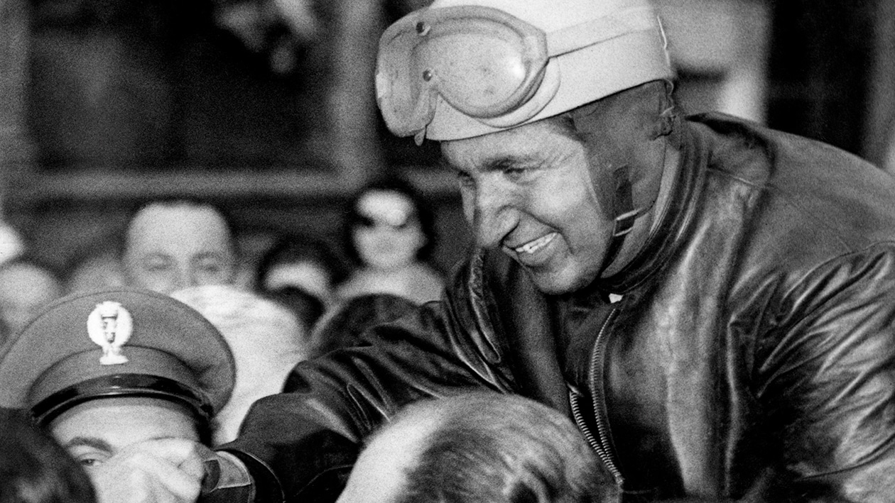 Alberto Ascari lifted above the crowd after winning 1954 Mille Miglia