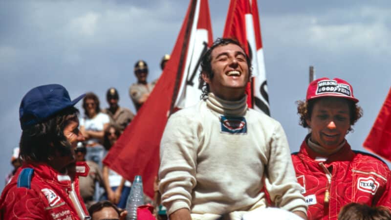 Carlos Pace on the Interlagos podium after winning the 1975 Brazilian GP