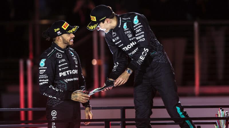 Lewis Hamilton congratulates George Russell on the podium ater the 2024 F1 Las Vegas Grand Prix