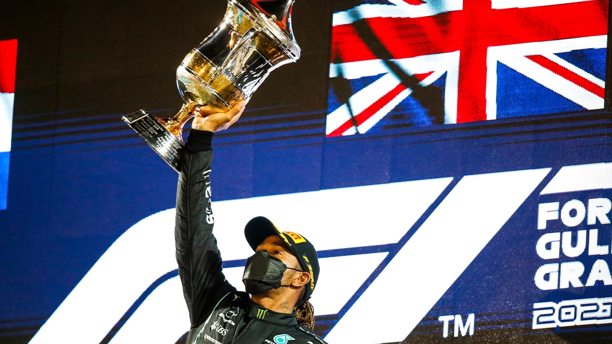 Lewis Hamilton raises trophy after winning 2021 Bahrain GP