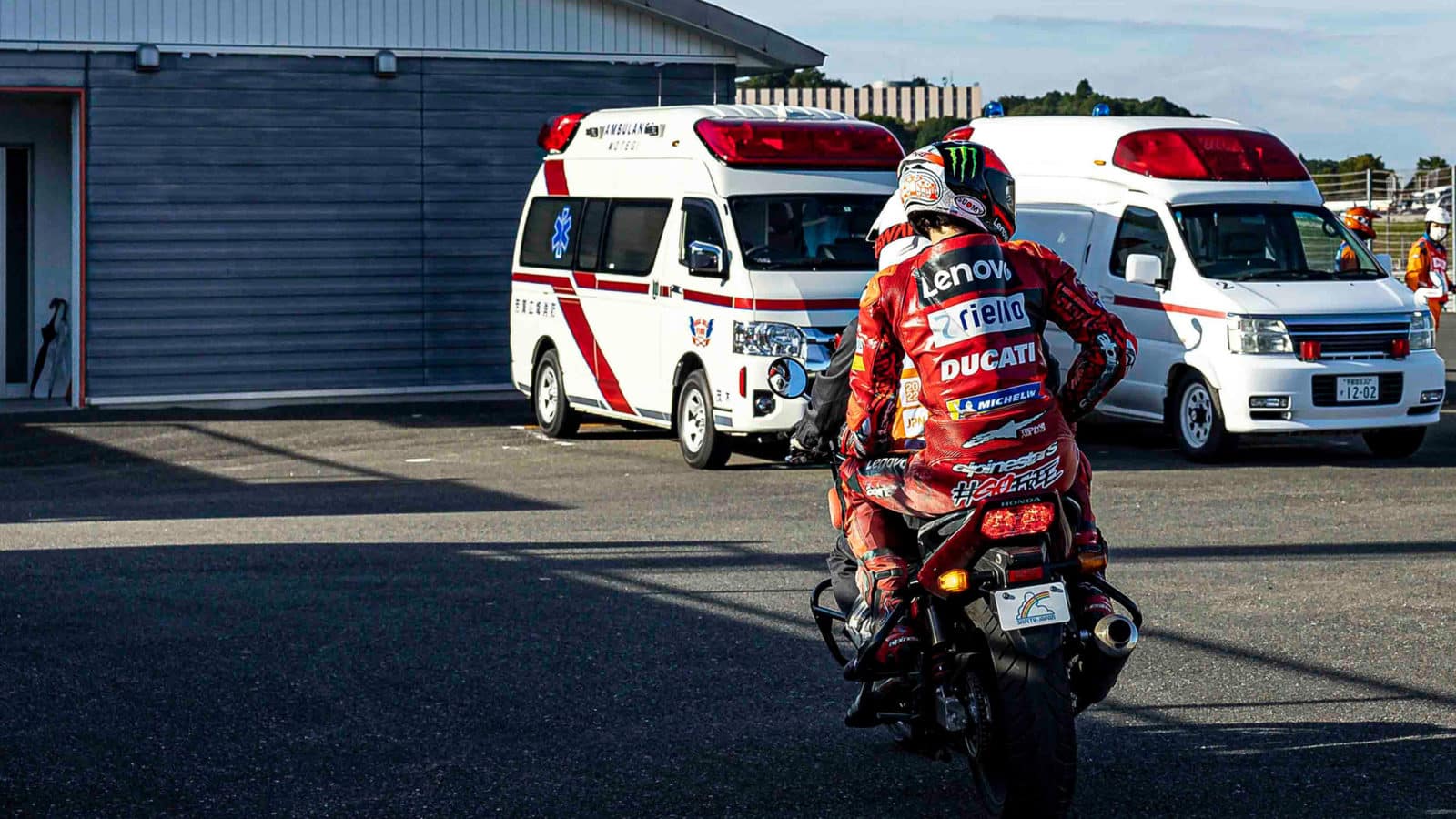 Pecco Bagnaia in scuffed race suit returns to MotoGP Motegi pit in 2022