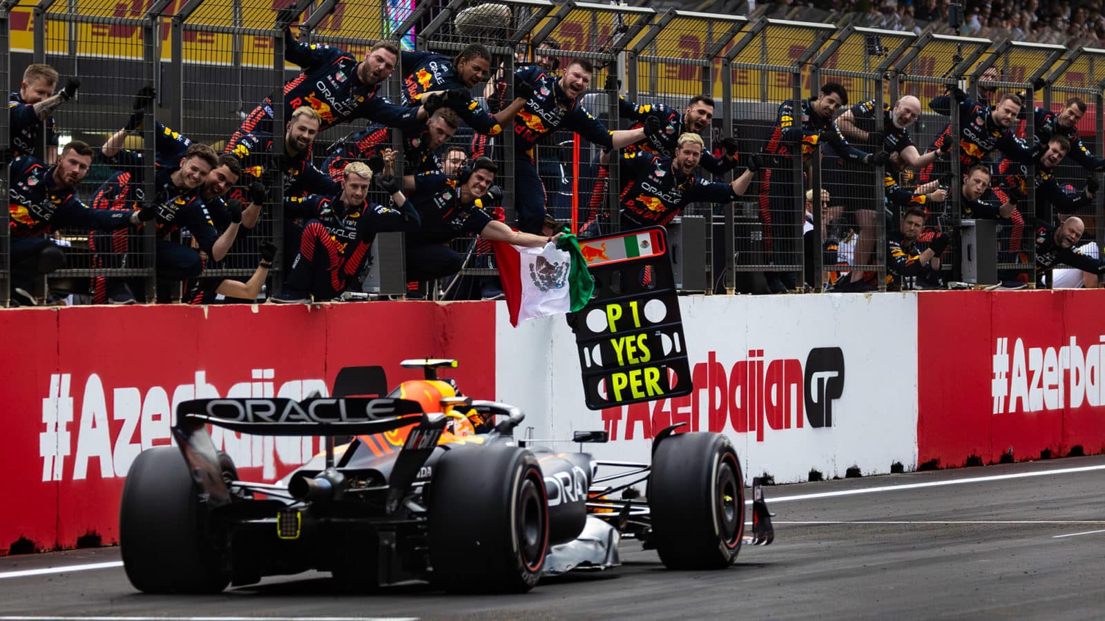 Sergio Perez drives past cheering Red Bull team as he wins the 2023 Azerbaijan GP
