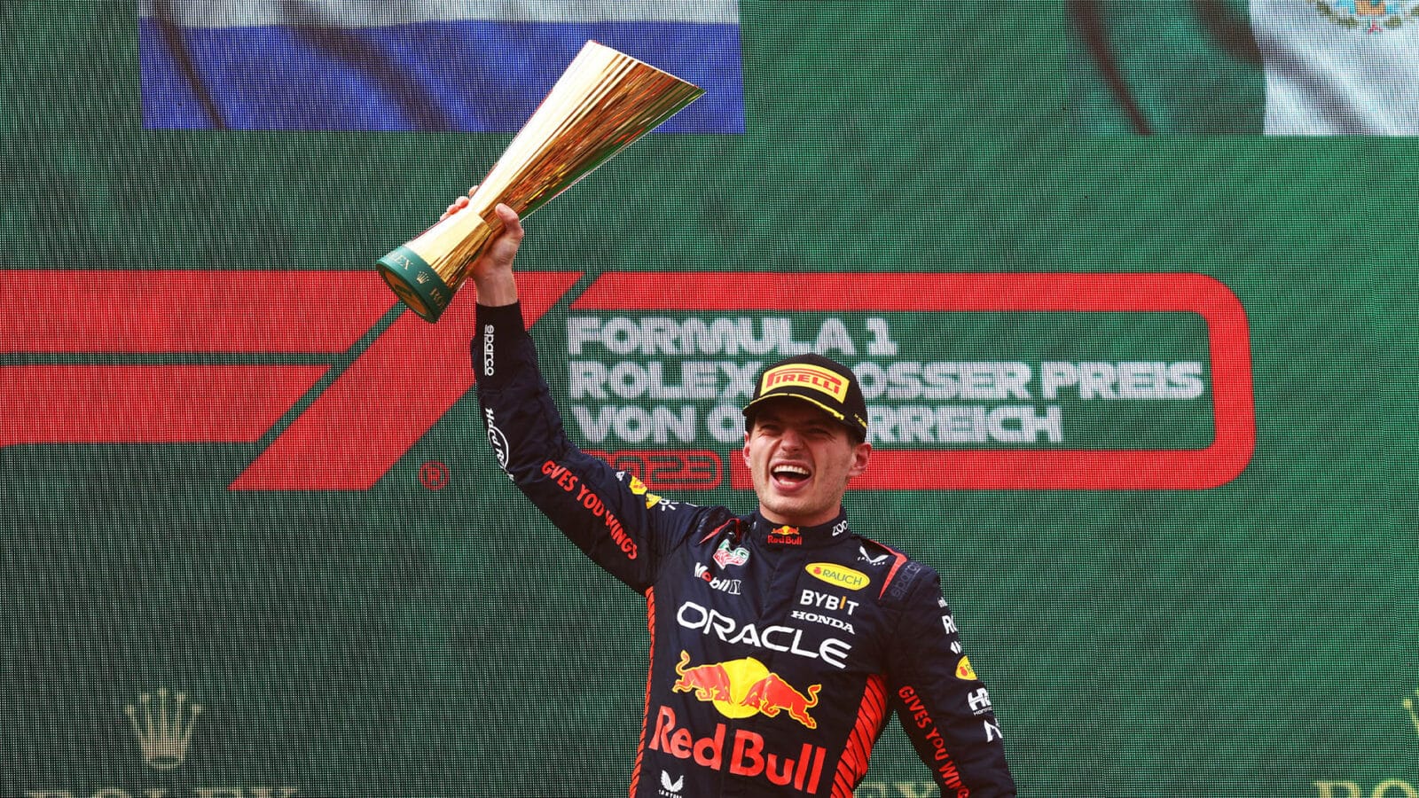 Max Verstappen with winning trophy on 2023 F1 Austrian GP podium