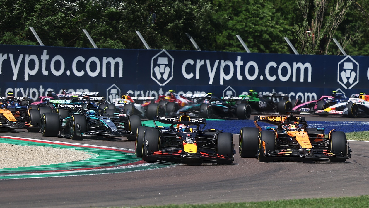 Max Verstappen takes the lead of the 2025 F1 Emilia Romagna Grand Prix from Oscar Piastri at Imola