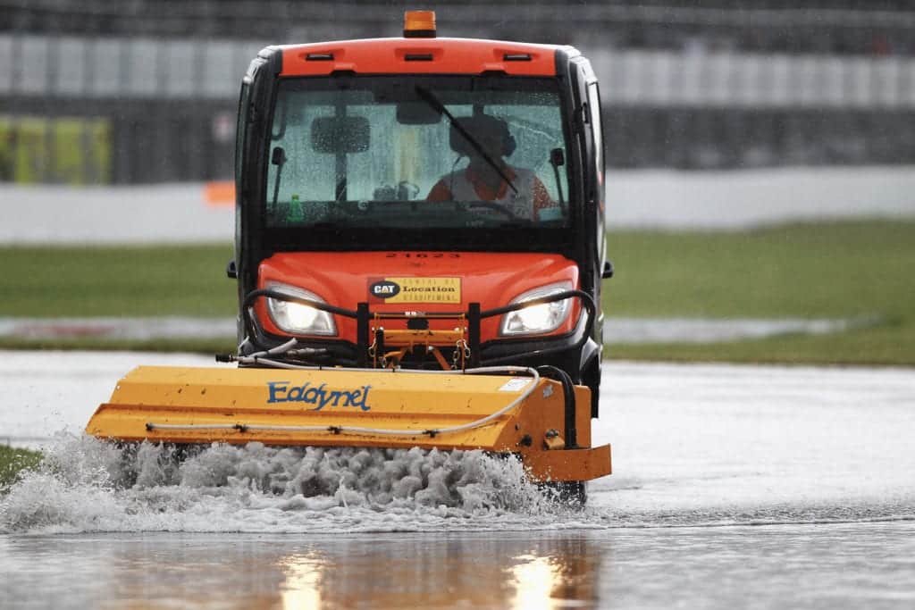 Water being cleared from the track while the 2011 canadian grand prix is stopped