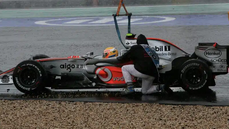 Lewis Hamilton rejoins the 2007 European Grand Prix at the Nurburgring after going off and being lifted out of the gravel by a crane