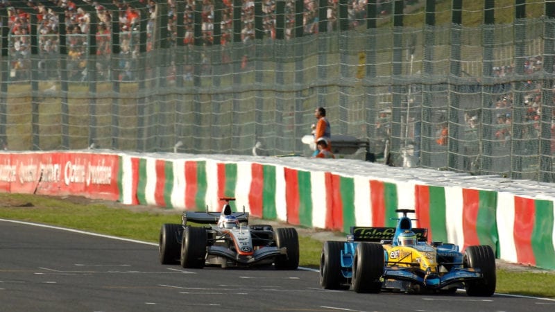 Kimi Raikkonen follows Giancarlo Fisichella in the Benetton during the 2005 Japanese Grand Prix at Suzuka