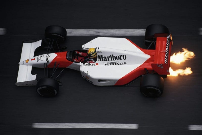 Flames burst from the back of Ayrton Senna's McLaren Honda at the 1991 Monaco Grand Prix