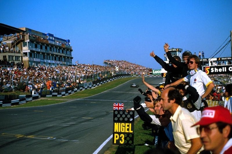 The Lotus team celebrate Nigel Mansell's 3rd place.