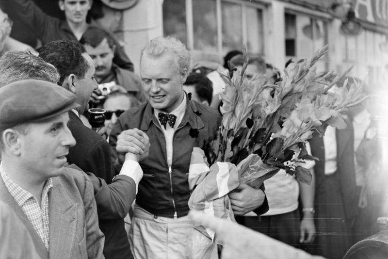 Mike Hawthorn celebrating his victory at the French GP.