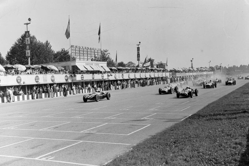 Jack Brabham (Cooper T51 Climax) leads Stirling Moss (Cooper T51 Climax) and Tony Brooks (Ferrari 246) at the start of the Italian GP at Autodromo Nazionale Monza.
