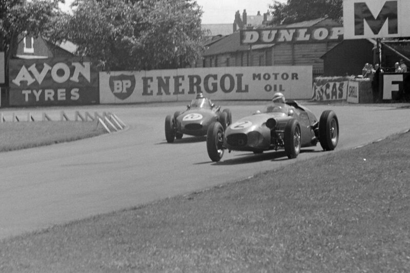 Roy Salvadori in an Aston Martin DBR4/250, leads Tony Brooks in a Vanwall.