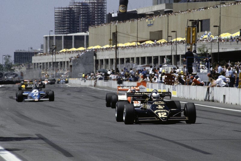 Nigel Mansell, Lotus 92 Ford, leads Niki Lauda, McLaren MP4-1C Ford, and Raul Boesel, Ligier JS21 Ford.