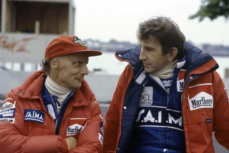 Niki Lauda speaks to team-mate John Watson.