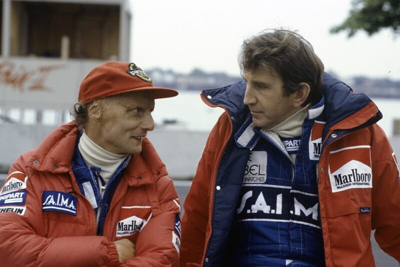 Niki Lauda speaks to team-mate John Watson.