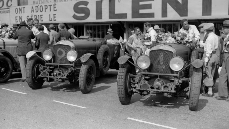 22nd June 1930: A group of drivers and racing cars during the Le Mans 24 Hour Endurance Race. (Photo by Fox Photos/Getty Images)