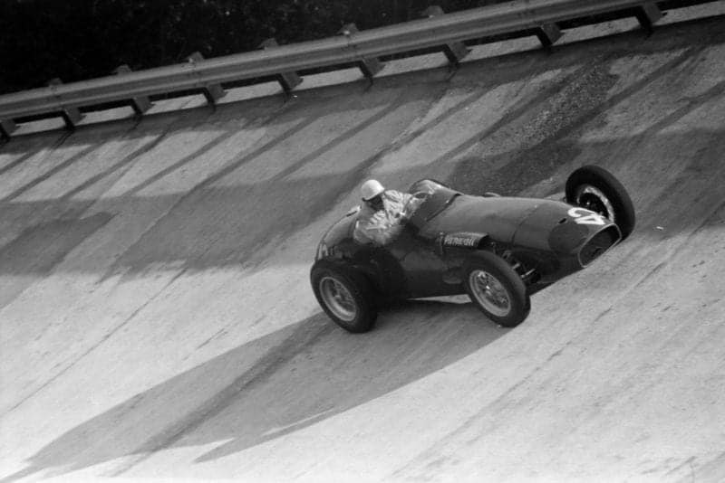 Harry Schell takes to the banking in his Vanwall