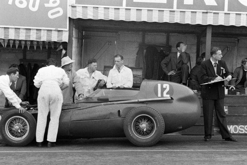 Trintignant's Vanwall is seen to in the pits