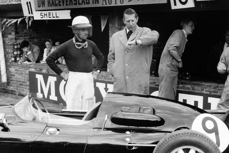 Team Owner Rob Walker checks the time with his driver Maurice Trintignant and Cooper T45-Climax who finished in 9th position