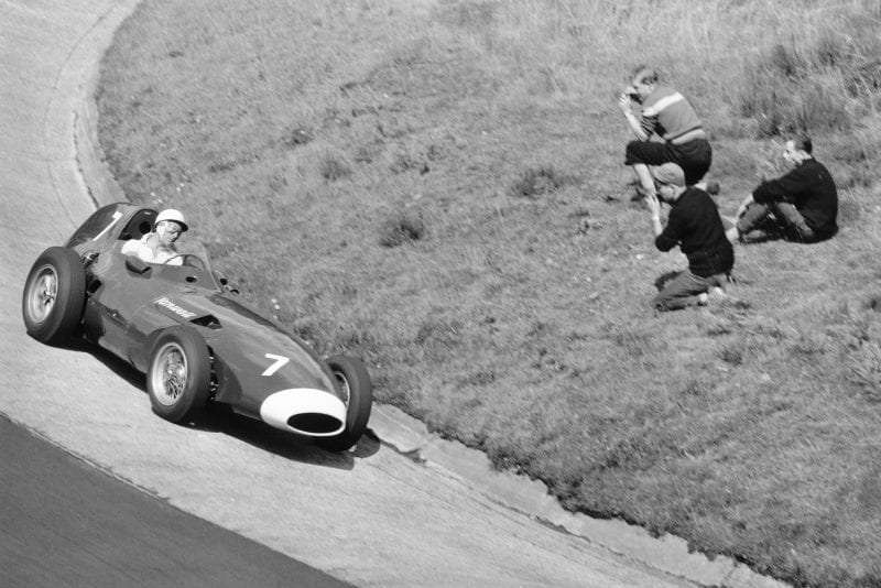 Stirling Moss takes his Vanwall around the Karussel.