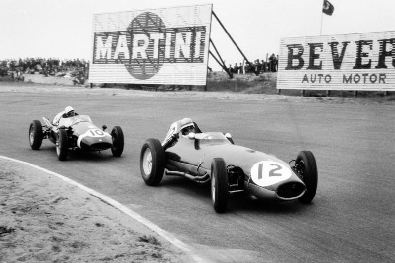 Innes Ireland driving a Lotus 16-Climax leads Maurice Trintignant at the wheel of a Cooper T51-Climax.