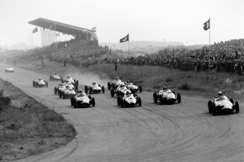 The pack leaves the start line - Jo Bonnier, BRM P25, leads Harry Schell, BRM P25, Masten Gregory, Cooper T51-Climax, Tony Brooks, Ferrari Dino 246, Jack Brabham, Cooper T51-Climax, Jean Behra, Ferrari Dino 246, Graham Hill, Lotus 16-Climax and Stirling Moss, Cooper T51-Climax. Carel Godin de Beaufort's Porsche RSK is barely off the line