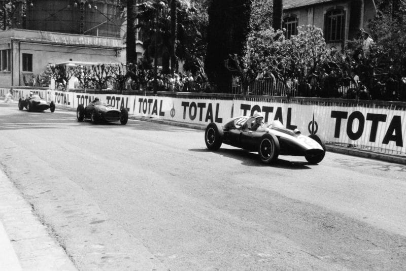Bruce McLaren in a Cooper T51-Climax leads Tony Brooks in his Ferrari Dino 246 and Harry Schell driving a BRM P25