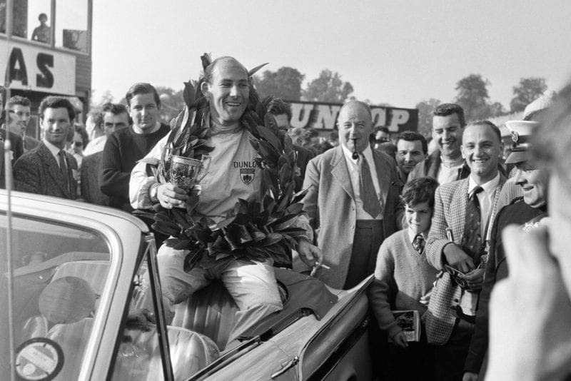 Stirling Moss, driving a Lotus-Climax, wins the Gold Cup race at Oulton Park, Cheshire, 24th September 1960. (Photo Bob Rendle/Mirrorpix/Getty Images)