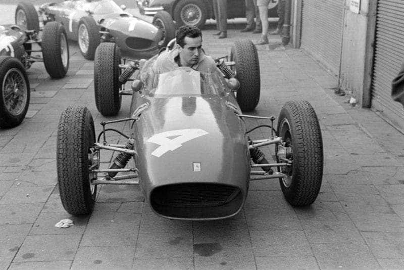 Bandini brings his Ferrari into the paddock