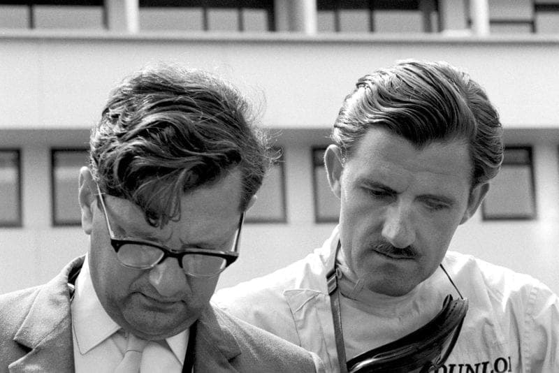 BRM's Graham Hill and Tony Rudd prepare for the race