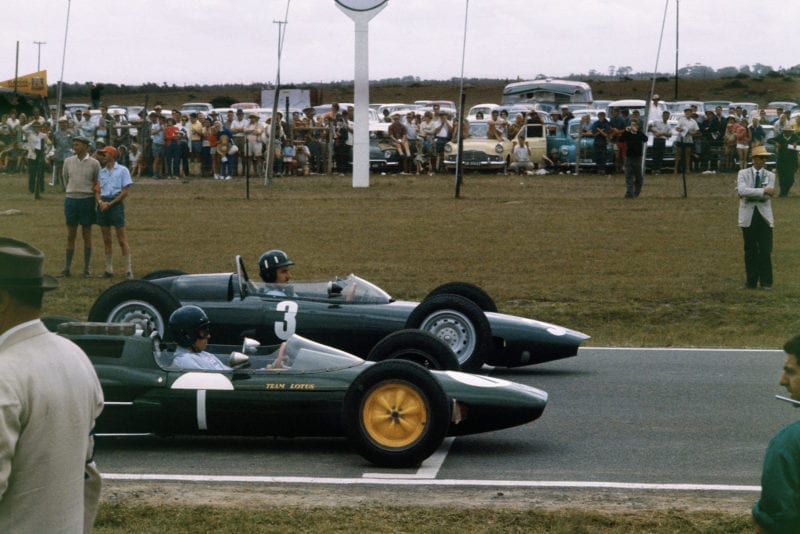 Graham Hill (BRM P57) and Jim Clark (Lotus 25 Climax) line up on the front row of the grid for their championship decider.