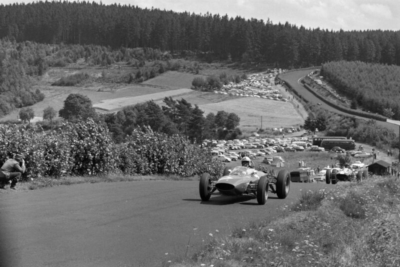 John Surtees, Ferrari 156/63, leads Jim Clark, Lotus 25 Climax.