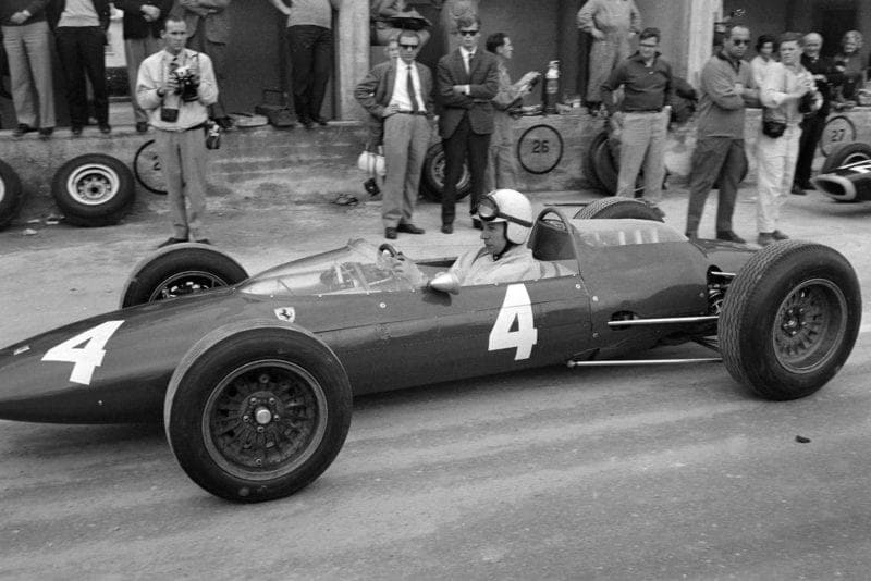 John Surtees, Ferrari 156 Aero, pulls out of the pits.
