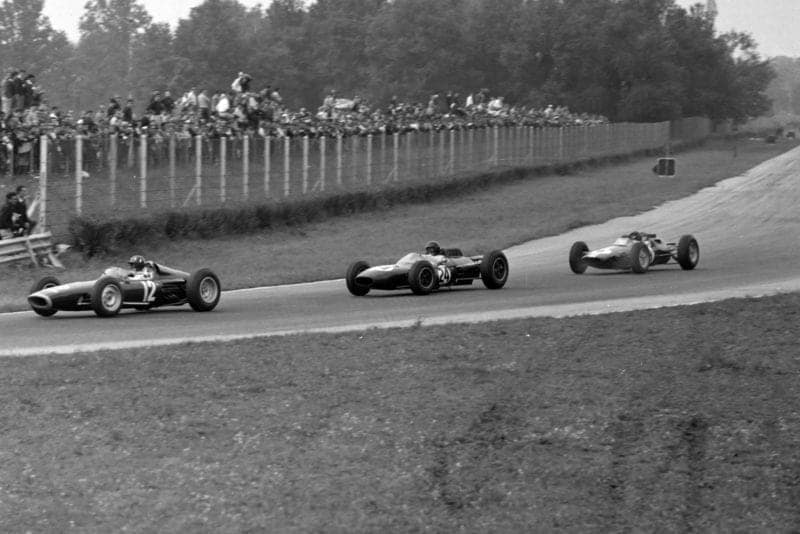 Graham Hill, BRM P61, leads Dan Gurney, Brabham BT7 Climax, and Jim Clark, Lotus 25 Climax.