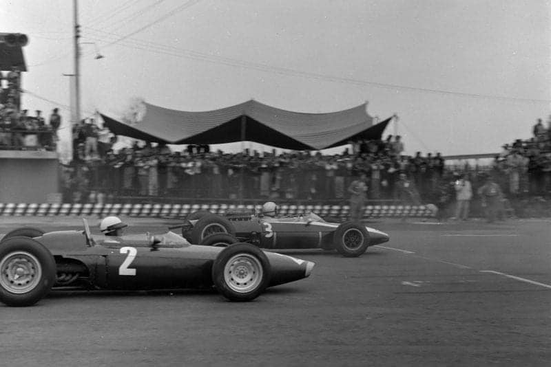 Richie Ginther, BRM P57, alongside Bruce McLaren, Cooper T66 Climax.