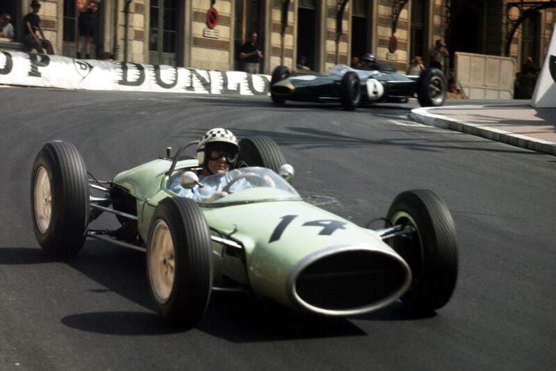 Innes Ireland (Lotus 24 BRM) leads Dan Gurney (Brabham BT7 Climax) in Station Hairpin.