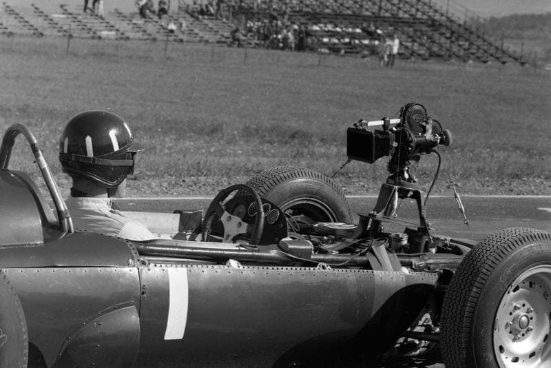 Graham Hill, BRM P57, with a rear-facing camera attached.