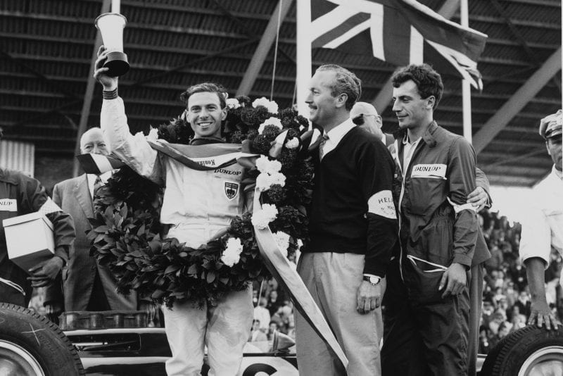 Winner Jim Clark on the podium with Colin Chapman.