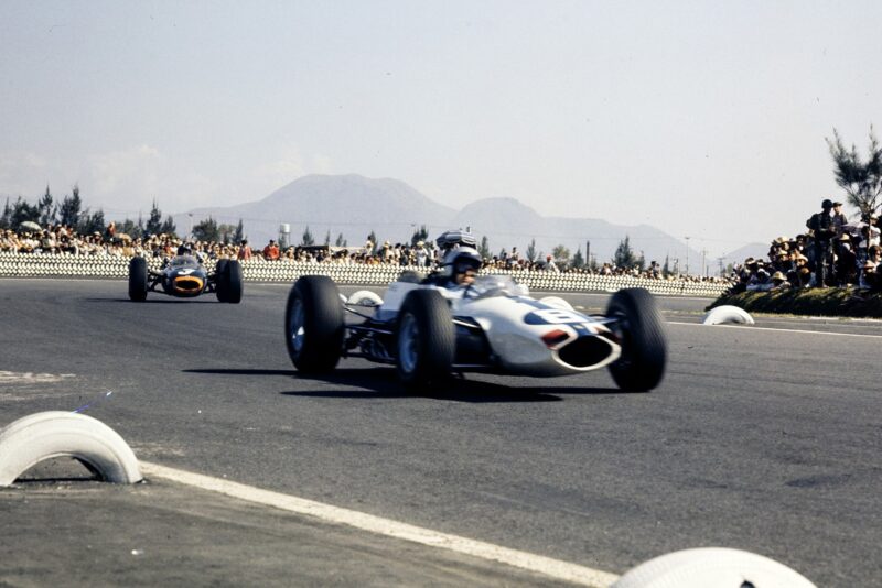 Lorenzo Bandini, Ferrari 1512 leads Graham Hill, BRM P261.