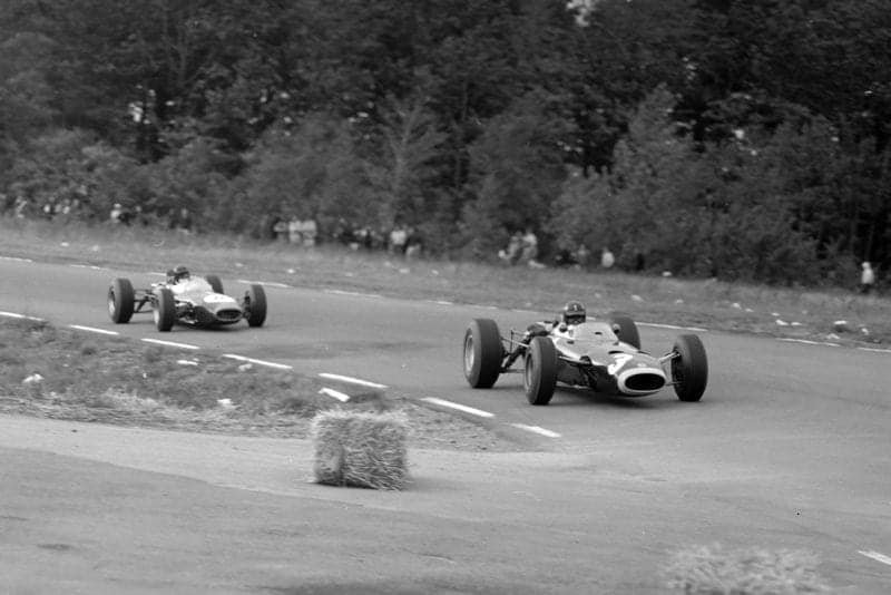 Graham Hill, BRM P261, leads Dan Gurney, Brabham BT11 Climax.