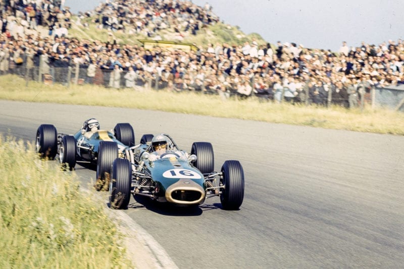 Jack Brabham, Brabham BT19 Repco leads Jim Clark, Lotus 33 Climax.