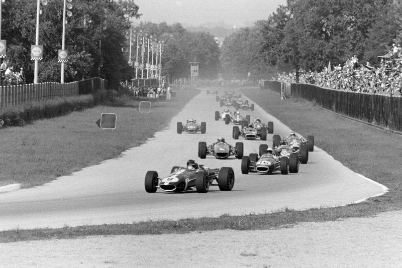 Dan Gurney, Eagle T1G Weslake, leads Jack Brabham, Brabham BT24 Repco, Graham Hill, Lotus 49 Ford, Bruce McLaren, McLaren M5A BRM, Jim Clark, Lotus 49 Ford, and the rest of the field on the opening lap.Dan Gurney, Eagle T1G Weslake, leads Jack Brabham, Brabham BT24 Repco, Graham Hill, Lotus 49 Ford, Bruce McLaren, McLaren M5A BRM, Jim Clark, Lotus 49 Ford, and the rest of the field on the opening lap.
