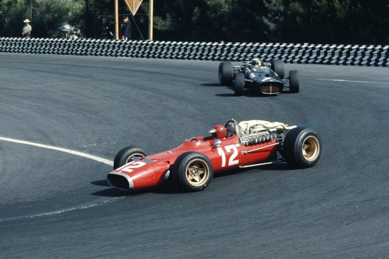 1967 Mexican Grand Prix.Mexico City, Mexico.20-22 October 1967.Jonathan Williams (Ferrari 312) followed by Jackie Stewart (BRM P115). Williams finished in 8th position.