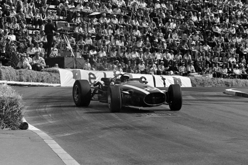 Jochen Rindt, Cooper T81B Maserati, gets sideways on the exit of the Station Hairpin.