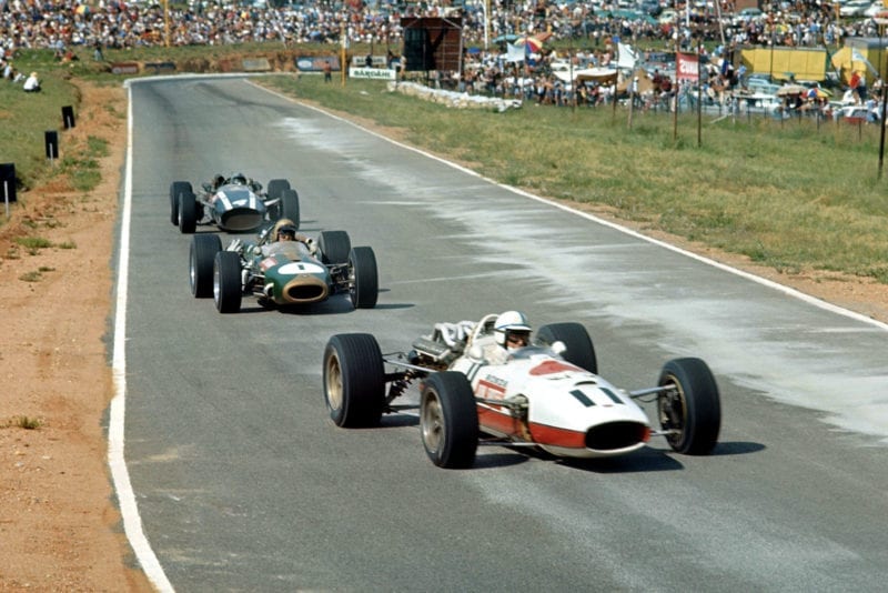 John Surtees (GBR) Honda RA273, leads Jack Brabham (AUS) Brabham Repco BT20, and eventual winner Pedro Rodriguez (MEX) Cooper Maserati T81.