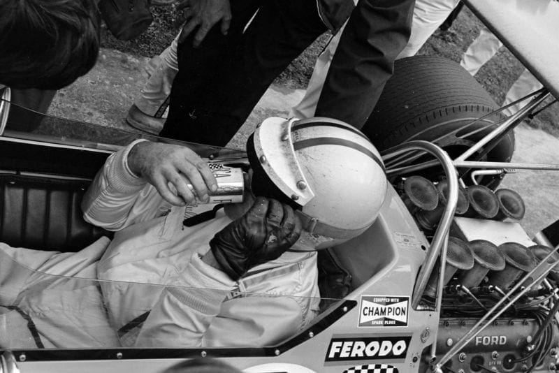 Denny Hulme takes a drink after winning the 1968 Canadian Grand Prix.
