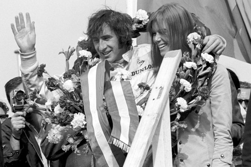 Jackie Stewart celebrates winning the 1969 Dutch Grand Prix on the podium