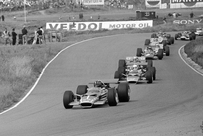 The field threads through the opening turns of Zandvoort at the 1969
