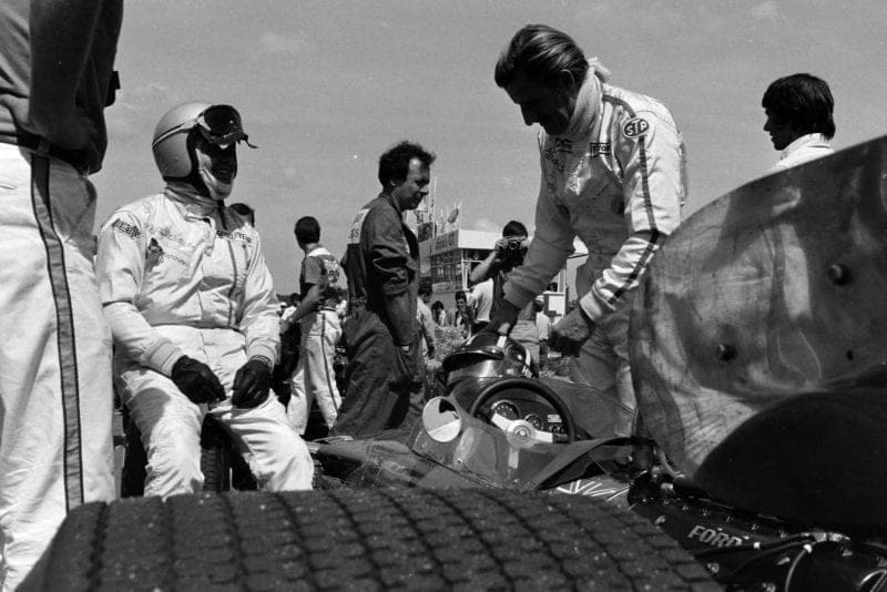 Graham Hill stands by his car before the 1969 French Grand Prix.