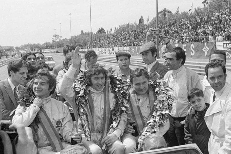 Jackie Stewart celebrates winning the 1969 Spanish Grand Prix.